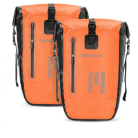 Deux sacoches de porte-bagage vélo orange et noires posées côte à côte vue de face