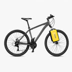 Sacoche de fourche vélo jaune fixée sur un VTT gris vue de côté