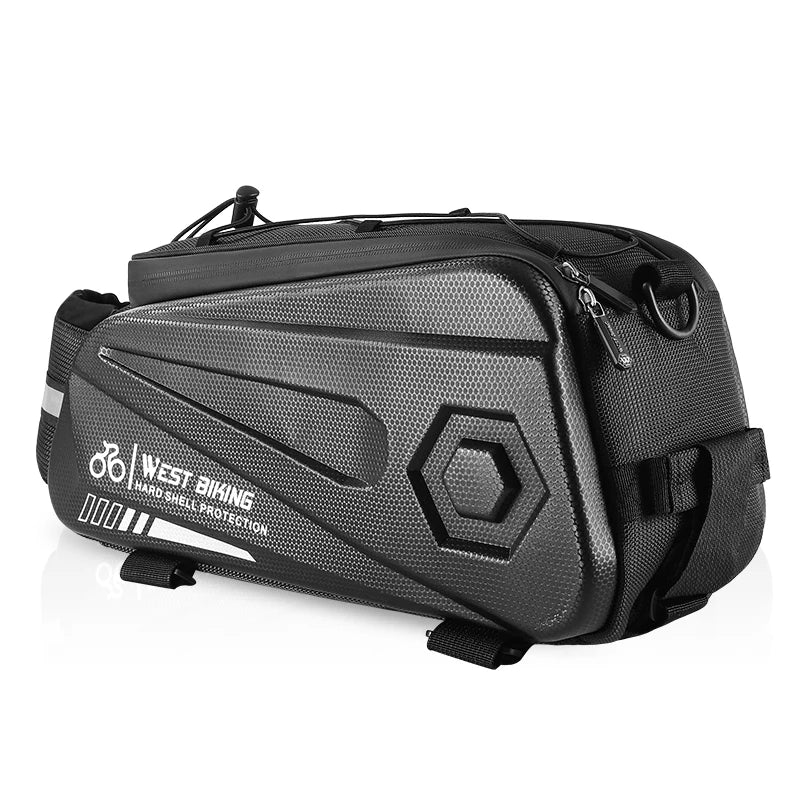 Sacoche de porte bagage arriere noire a coque rigide avec sangles de fixation presentee sur fond blanc.
