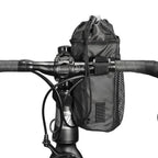 Sacoche de potence noire fixée sur le guidon d'un vélo avec poche latérale à maillage