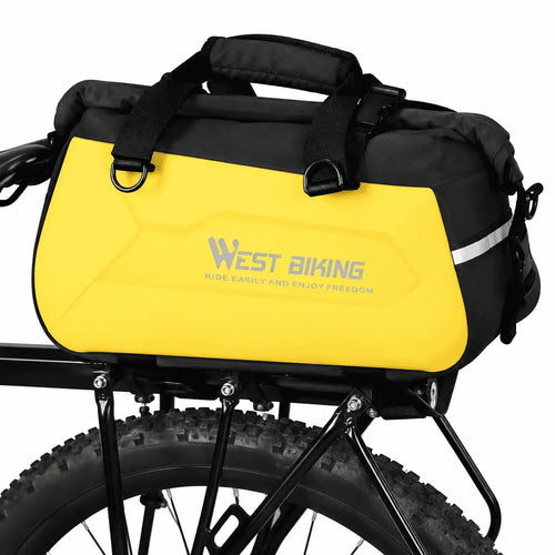 Sacoche vélo rigide jaune et noire fixée sur le porte-bagages arrière, poignée supérieure et bande réfléchissante latérale