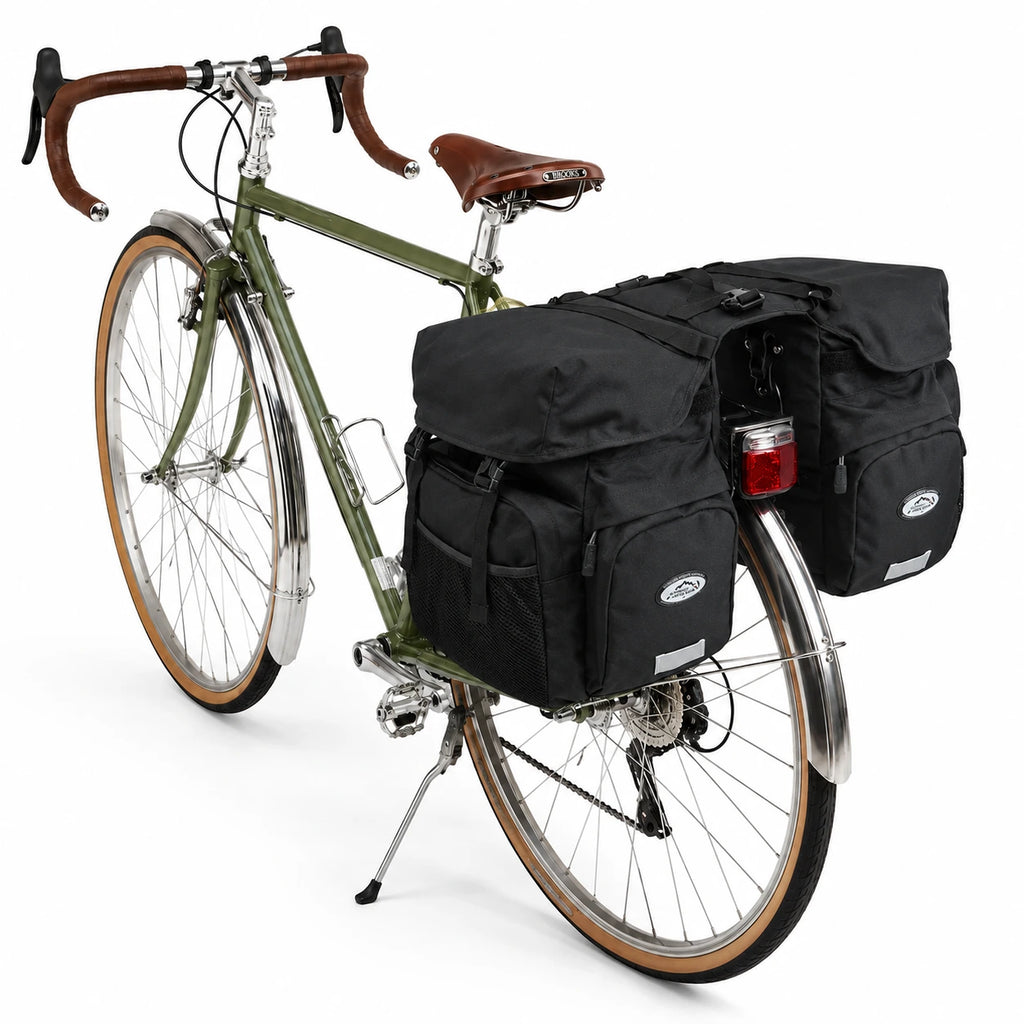 Sacoche vélo porte-bagage triple noire sur vélo vintage vert