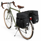 Sacoche vélo porte-bagage triple noire sur vélo vintage vert