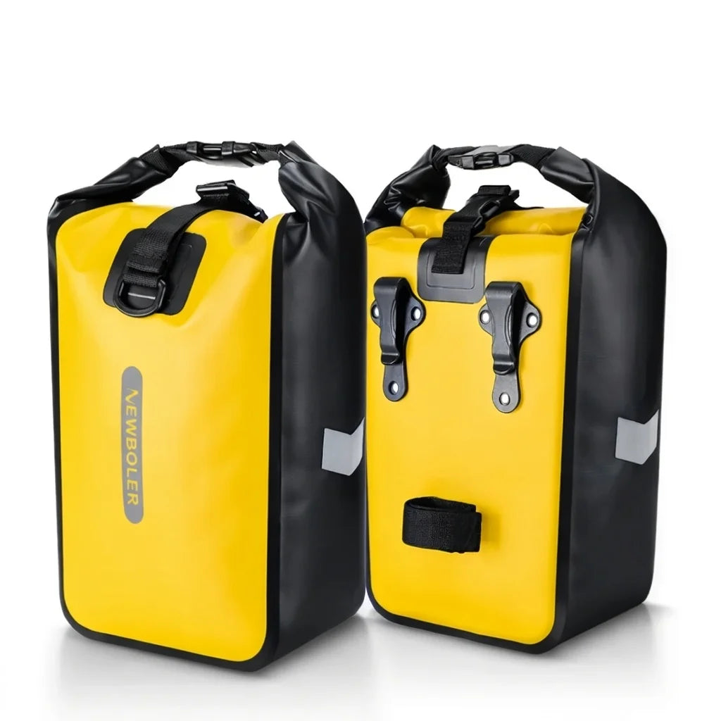 Paire de sacoches de porte-bagages jaunes et noires avec fermeture roll-top etanche, presentees sur fond blanc.