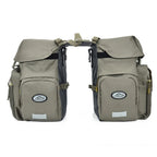 Paire de sacoches de porte-bagages kaki avec multiple poches et rabat, presentees sur fond blanc.